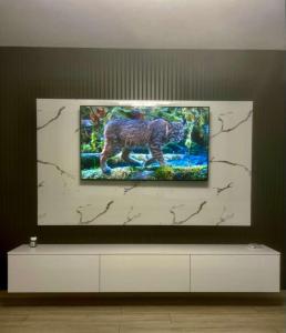 a painting of a dog on a wall at Cristian's Home in Drobeta-Turnu Severin