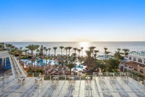 a view of the beach and the ocean from a resort at Pickalbatros Royal Grand Sharm - Adults Friendly 16 Years Plus in Sharm El Sheikh