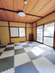 Ένα ή περισσότερα κρεβάτια σε δωμάτιο στο プリンセスハウス 6