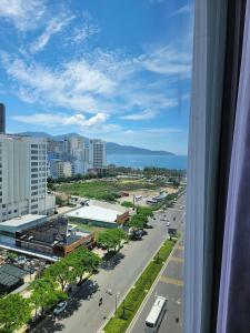 a view from a window of a city with a street at GOLDEN SUN DANANG Hotel in Da Nang