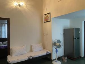 Postel nebo postele na pokoji v ubytování Sri Ranga Nilaya + 4 fotografie