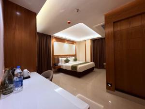 a hotel room with a bed and a bathroom at hotel Green view in Baharampur +33 photos