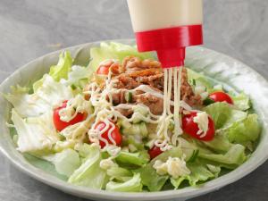 a salad with noodles and tomatoes in a bowl at APA Hotel Saga Ekimae Chuo in Saga