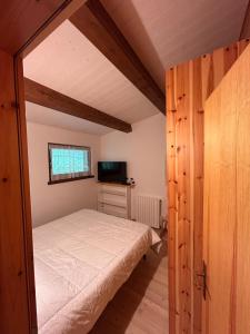 Postel nebo postele na pokoji v ubytování Chalet Lilly Andalo Relax & Sport