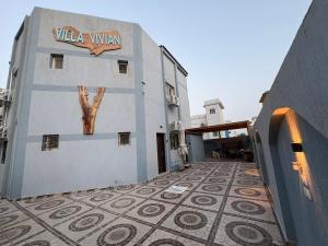 a building with a tiled floor and a sign on it at Villa Vivian in Saint. Catherine