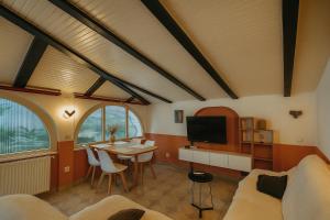 a living room with a couch and a table at Apartmani Višnja in Crikvenica