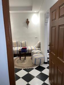 a living room with a couch and a table at Mini Studio in Marrakech