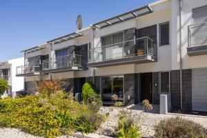 an apartment building with balconies and plants at Atlantic Panoramic Villa in Salir de Porto