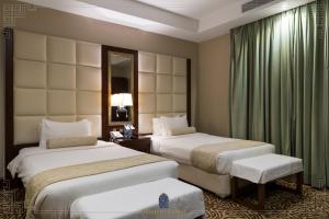 Postel nebo postele na pokoji v ubytování شقق لمار الغرب الفاخرة