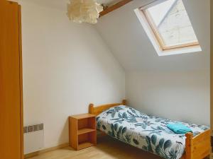 Ένα ή περισσότερα κρεβάτια σε δωμάτιο στο Au bois de la Belle