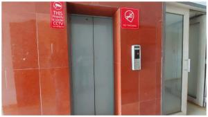 an elevator in a building with a cell phone on it at Hotel Park-Resort Bhubaneshwar Near Railway Station - A Premium Hotel Lift Facilites And Parking ,wifi - Fully Air Conditioning Luxury Room in Cuttack