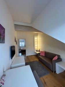 TV a/nebo společenská místnost v ubytování Haven Hotels - Helvetia Suites Düsseldorf City