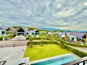 an aerial view of a house with a yard at Gaia Pool Villa Khao Yai in Ban Bung Toei