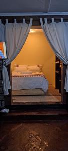 a bedroom with a bed with a canopy at Diani's Little Gem in Ukunda