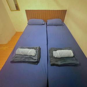 Ένα ή περισσότερα κρεβάτια σε δωμάτιο στο Yes Surf Siargao