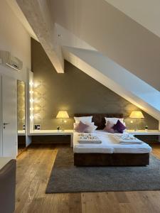 Postel nebo postele na pokoji v ubytování Haven Hotels - Helvetia Suites Düsseldorf City