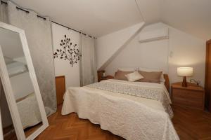 a bedroom with a large bed and a mirror at Iron Gates Apartments in Split +54 photos