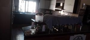 a kitchen with a counter top with a blender at Petra sharing room in Petra +14 photos