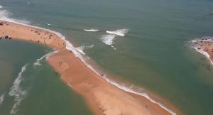 an overhead view of a beach with people in the water at Luxurious 4 bedroom Villa next to the lagoon in Somone