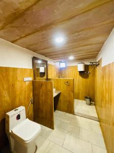 a bathroom with a toilet and a sink at The Mayara Fort Jaisalmer Camps in Jaisalmer