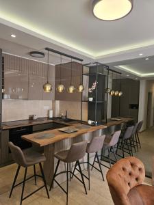 a kitchen with a large table and chairs at Miss Extra LuX in Mladenovac