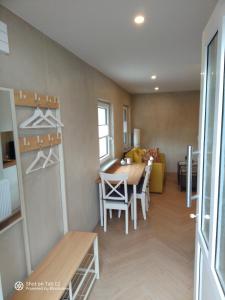 a living room with a table and a couch at Apartment Emma in Sandkrug in Hatten