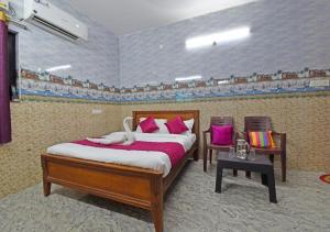 Postel nebo postele na pokoji v ubytování paradise beach resort pondicherry