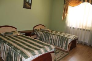 Postel nebo postele na pokoji v ubytování Passage Hotel