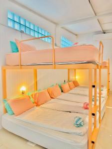 a group of bunk beds in a room at Lazy Sunday Khaosan Hotel in Bangkok