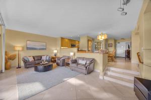 a large living room with couches and a kitchen at Kaanapali Royal C202 · KRL C202 2BD on Kaanapali Golf Course w P in Lahaina