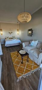 Ένα ή περισσότερα κρεβάτια σε δωμάτιο στο Maya's Studio