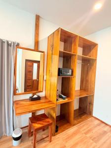 a room with wooden shelves and a mirror at Sea Beach at Lipe in Ko Lipe