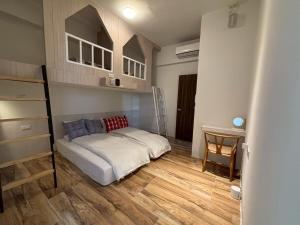 Una cama o camas en una habitación de 橘光山影