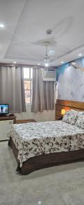 a bedroom with a large bed and a television at Dublin Hotel in Sao Paulo