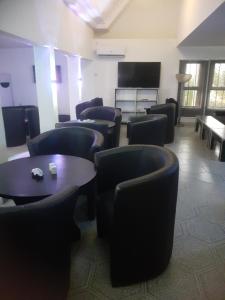 TV a/nebo společenská místnost v ubytování Orange Residence and Suites