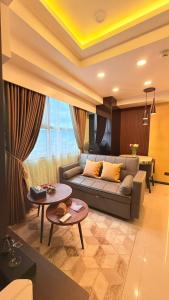 a living room with a couch and a table at LM50L2 horizon101 cebu in Cebu City