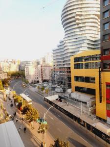 a city street with a tall building in the background at Tirana center view in Tirana