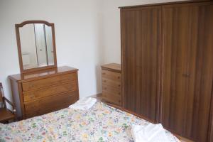 Ένα ή περισσότερα κρεβάτια σε δωμάτιο στο Ca' D'la Pèisa +1 φωτογραφίες