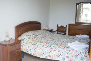 En eller flere senge i et værelse på Ca' D'la Pèisa