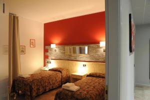Postel nebo postele na pokoji v ubytování Hotel del Ponte