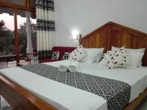 Giường trong phòng chung tại JunglevistaLake