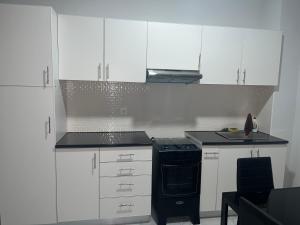 Nhà bếp/bếp nhỏ tại T0 Brisa Tropical