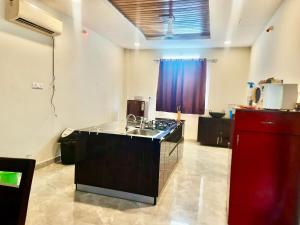 a kitchen with a sink and a counter top at SR Farm Stay in Turkapally