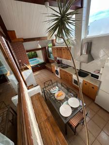 an overhead view of a kitchen with a table with plates at Villas Vairocana in Santillana del Mar
