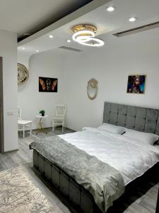a bedroom with a large bed in a room at Le Charme Hostel in Bucharest
