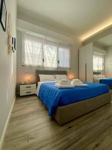 En eller flere senge i et værelse på Dream Catcher Apartment