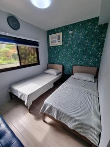 Postel nebo postele na pokoji v ubytování Miracle's Farm at Tarlac + 53 fotografií