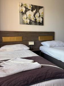 Postel nebo postele na pokoji v ubytování Hotel Montenegro