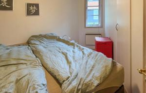 an unmade bed in a room with a window at Gorgeous Home In Hovborg With Wifi in Hovborg