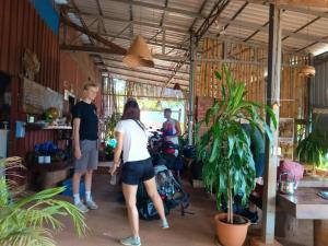 a group of people standing in a room at Avocados homestay in Banlung